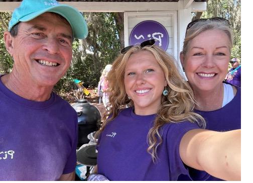 The Pi Artisan Pizza crew in purple shirts at market